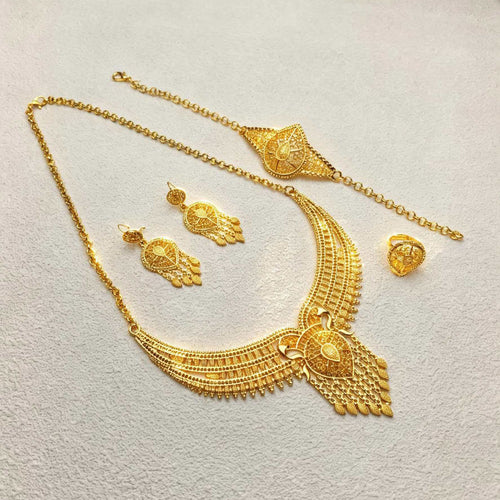 24K Gold Bridal Jewelry Set flat lay showing necklace, headpiece chain, earrings, and ring