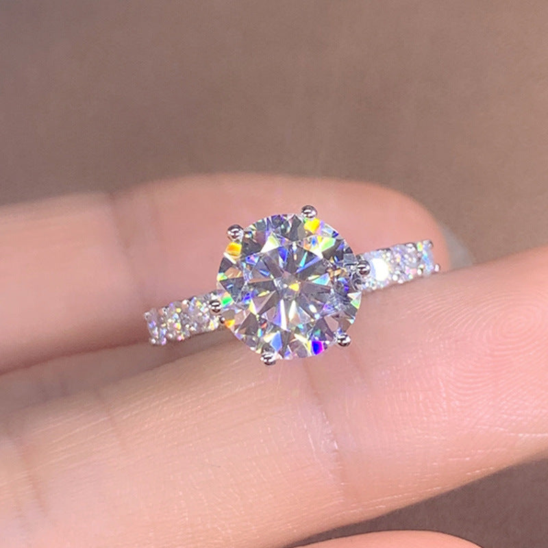Six-Prong Moissanite Ring worn on finger, showing sparkle and fit of the moissanite solitaire