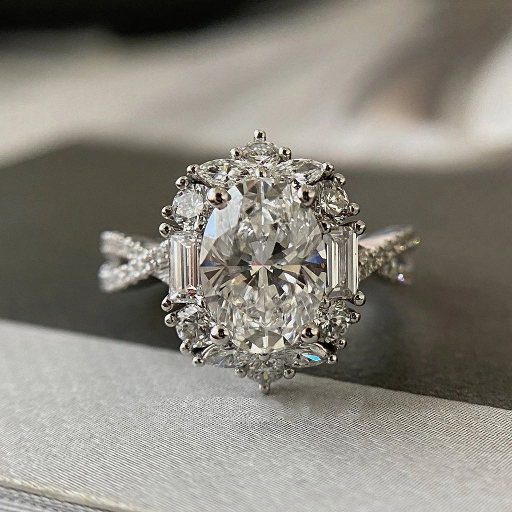 Close-up top view of the Oval Moissanite Cluster Ring showing the oval center stone and halo detail