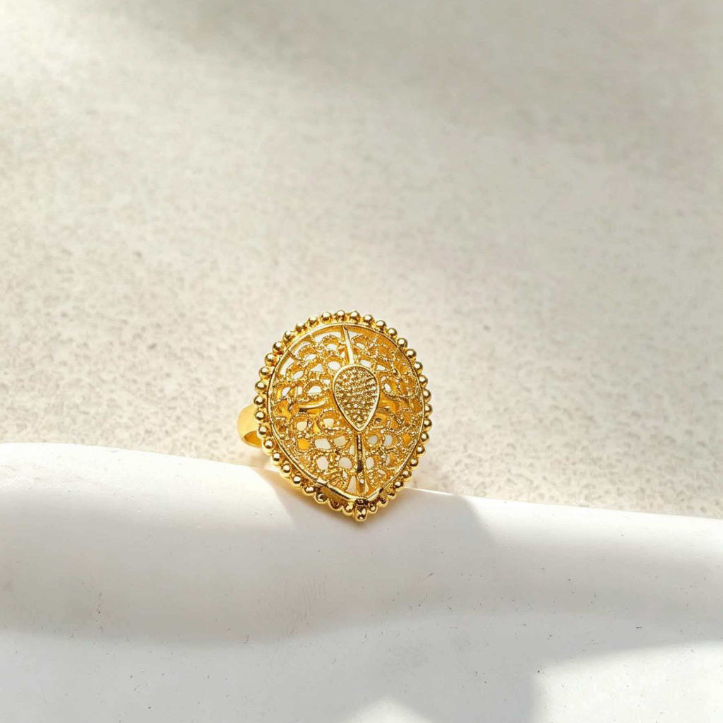 Close-up of 24K gold filigree ring from the bridal jewelry set