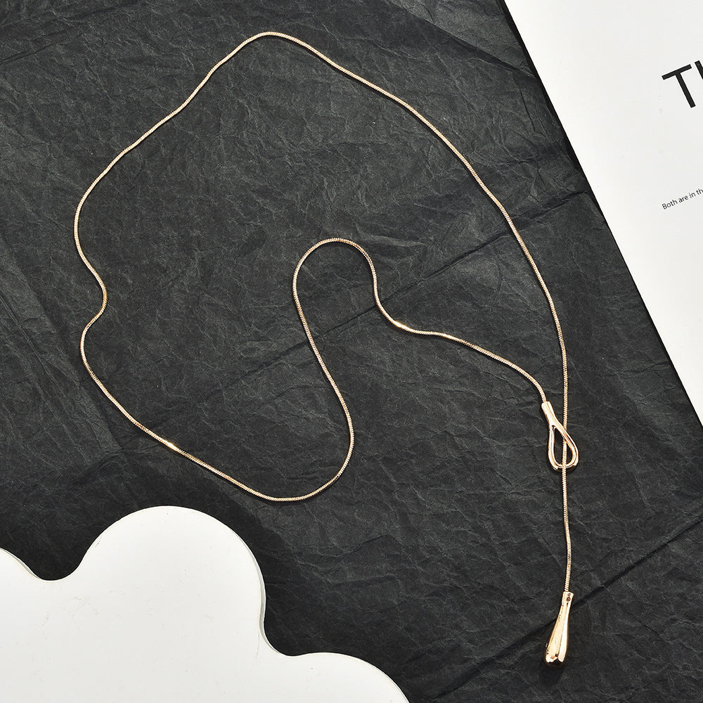 Full length of the snake chain laid out to show flexibility and adjustable design