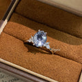 Firework-Cut Moissanite Ring in gray displayed in a ring box, faceted center stone