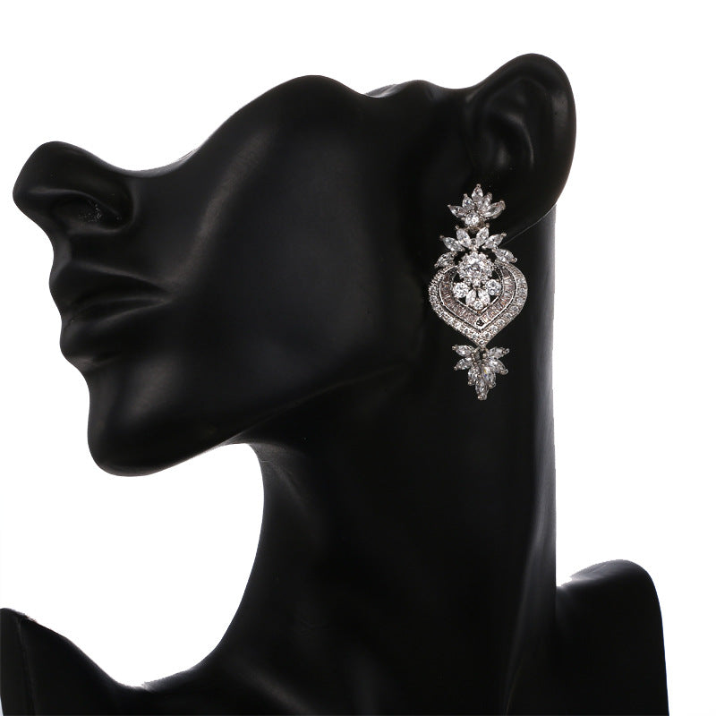 CZ Flower Drop Earring shown on black silhouette mannequin bust, side profile view