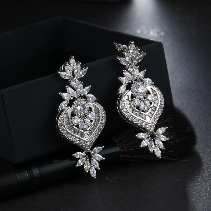 CZ Flower Drop Earrings, large flower-shaped cubic zirconia drops in silver-tone metal on styled black box