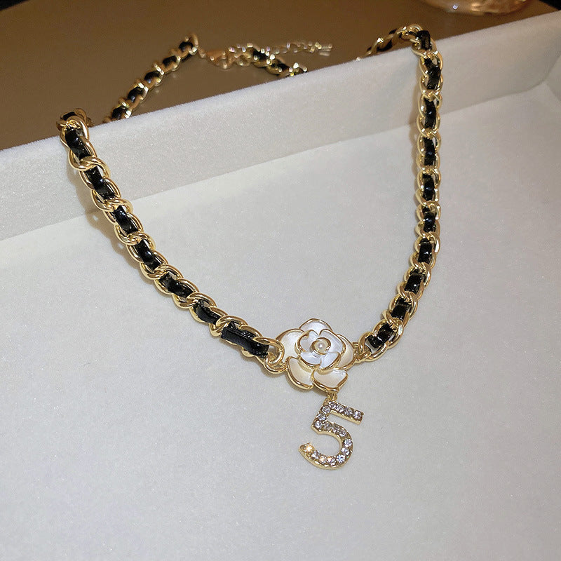 Camellia Pearl Pendant Necklace, black leather-wrapped chain with white camellia flower and crystal number 5 charm