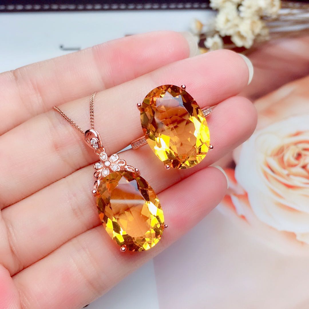 Citrine pendant necklace and matching ring from the Crystal Pendant Necklace Set, held together in hand