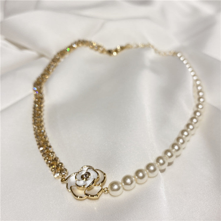 Camellia Pearl Pendant Necklace, pearl and gold crystal beaded chain with white camellia flower detail on white fabric